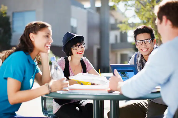 college students sharing a laugh together