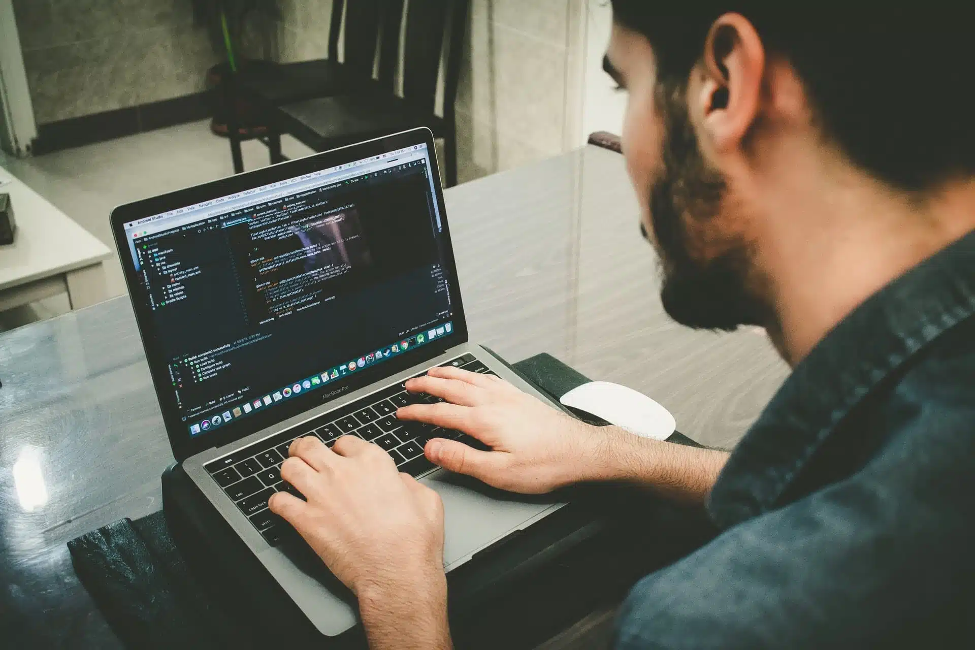 Man programming and coding on laptop