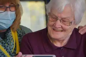 CNA caring for an elderly patient