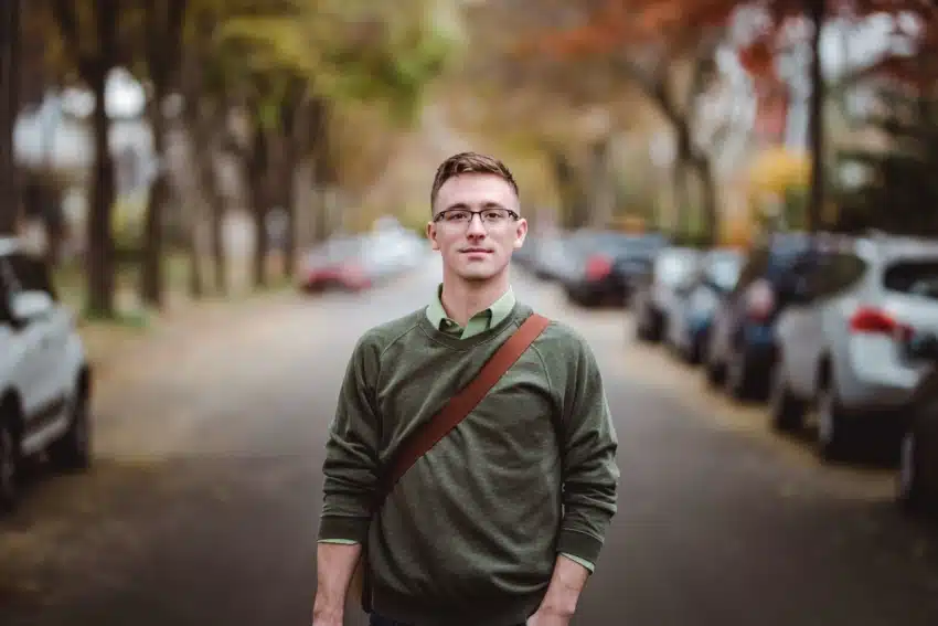 “Happy male student commuting to college”