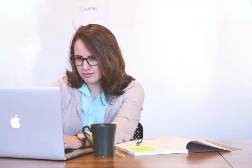 A female student at the University of the People referencing her work.
