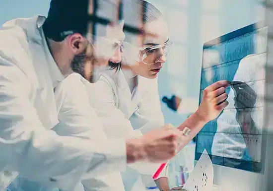 two healthcare technologists working together