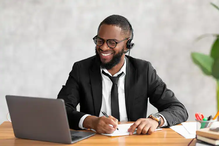 a male corporate employee earning his associate degree online