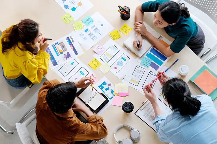 a group of young design thinkers working together on a project
