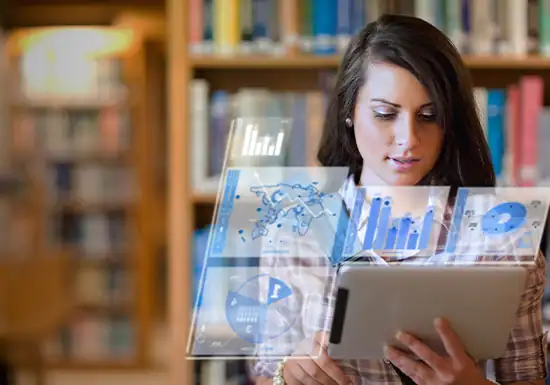 a female online college student preparing her computer science assignment in a library